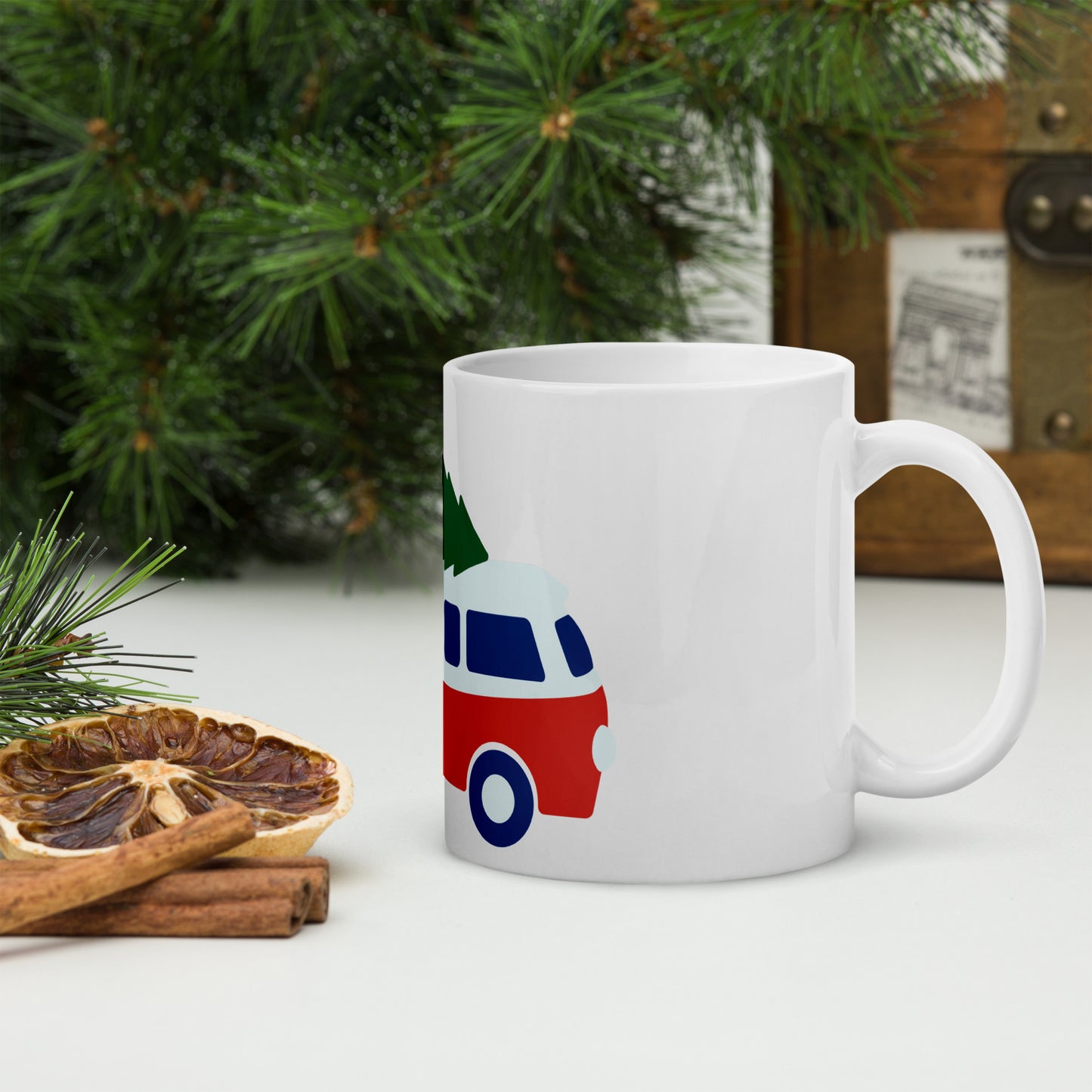 White glossy mug with retro camper van carrying a Christmas Tree